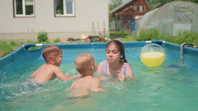 Youngsters Splashing And Playing In Sunny Pool, Children Engage In Energetic Water Games Beneath Bright Summer Sun, Lively Group Of Children Having Fun With Beachball In Outdoor Aboveground Pool