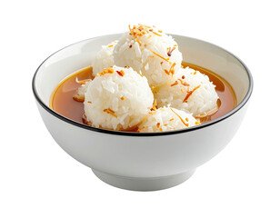 Rice Balls in Broth with Toasted Coconut Flakes in a White Bowl
