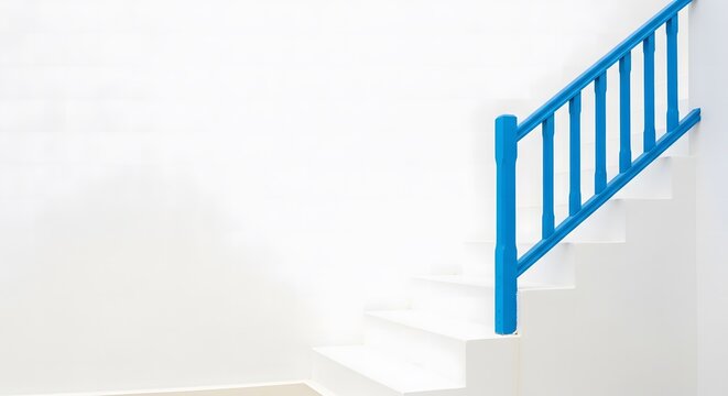 Minimalist white staircase with bright blue railing in Amorgos,