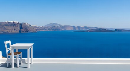 Fototapeta premium Minimalist white table and chair overlooking the deep blue Santo