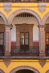 Colonial arches and balcony in internal courtyard of Morelia, Mexico