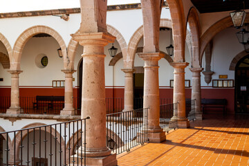 Colonial courtyard with arches and lanterns in Morelia, Mexico