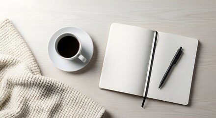 White coffee cup open notebook black pen on light wood surface white cup saucer
