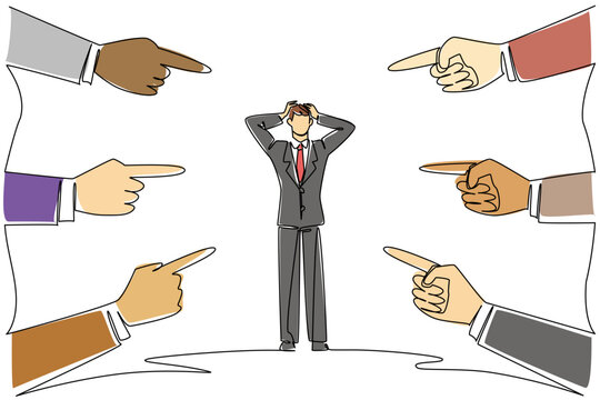 Continuous line drawing of an overwhelmed businessman being blamed by many pointing fingers for a business concept. This scapegoat theme is related to National Blame Someone Else Day event.