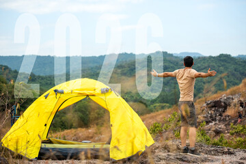 The start into the new year 2026. Young people tourist raise arm relax in tent after activity outdoor for destination leisure and go to goal success new year