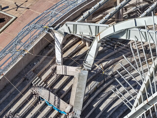 Fototapeta premium Aerial view of a coliseum with structural damage and concrete columns destroyed by a collapse