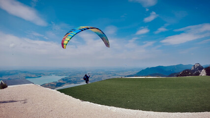 Learning process of paragliding in the mountains in spring