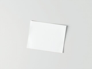 Blank white paper square on a plain light gray background