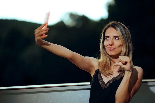 Narcissistic Woman Pointing at Herself while Taking a Picture. Vain egocentric lady being self centered and overly confident 