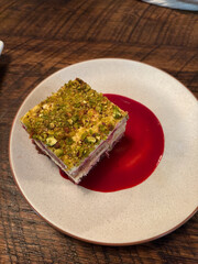 A plate of raspberry tiramisu cake.