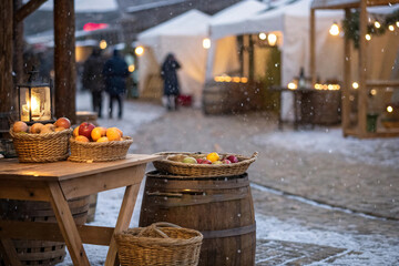 Rustic market vignette with kinara on nearby Muhindi and woven baskets of fruits