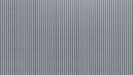Corrugated metal panel with a vertical ribbed texture, ideal for backgrounds and industrial design elements