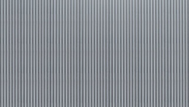 Corrugated metal panel with a vertical ribbed texture, ideal for backgrounds and industrial design elements