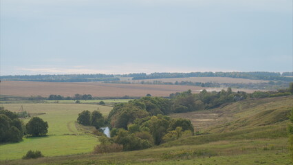 Obraz premium Experience the breathtaking beauty of the countryside with rolling hills, offering peace