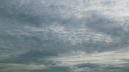 The sky is overcast with a textured cloud formation, creating an intriguing atmosphere