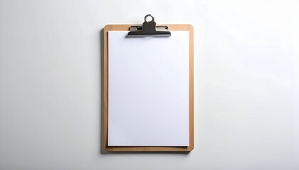 Minimalist wooden clipboard with blank white paper, symbol of clean slate and fresh start.