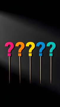 light bulbs on a white background, Five colorful question marks on sticks, arranged in a row against a dark backdrop. These symbols represent inquiry, uncertainty, and the unknown, perfect for educati