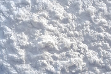 Obraz premium The surface is covered with uneven, fluffy white snow.