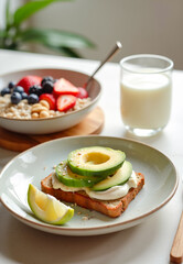 Vegan breakfast spread featuring avocado toast, fresh fruits, oatmeal with berries, chia seeds, nuts, and a glass of plant-based milk. Vertical shot.