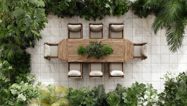 a top view of an outdoor dining table with chairs, surrounded by lush green plants and a gray tile floor