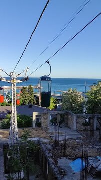SMALL CABLE CAR, YALTA - 07 MAY 2024: The suspended road has been in operation for over 50 years. Each cabin is designed for two people.