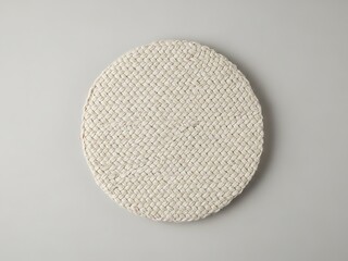 Minimalist Woven Round Mat on Neutral Background, Modern Table Setting
