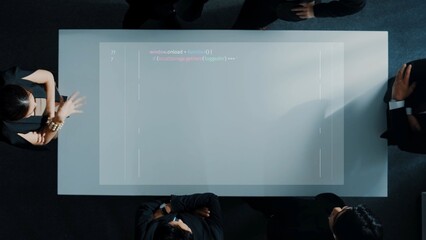 Aerial view of a business meeting featuring professionals in formal attire discussing agenda items around a sleek conference table. The atmosphere is collaborative. Raster