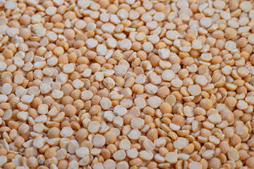Fototapeta premium Macro shot yellow split peas protein, ingredient styling for plantbased meals and highprotein messaging, crisp detail and neutral backdrop for nutrition content