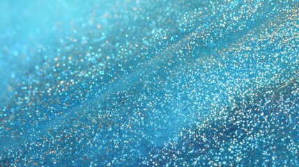 Obraz premium A close view of a blue glitter surface shows shimmering particles reflecting light. The texture suggests a use for craft projects party decorations or artistic designs.