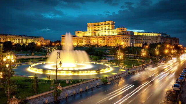Palace of the parliament and illuminated fountain in bucharest, romania at twilight with light trails from traffic, 4k high quality footage