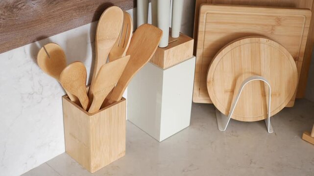 Wooden utensils and kitchen items on a countertop