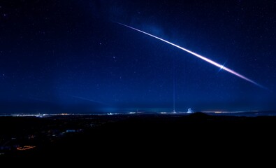 A breathtaking view of the night sky reveals a stunning display of stars and celestial formations wide panoramic deep blue backdrop meteor abstract background meteor galaxy space background sky