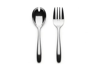 Polished stainless steel salad serving spoon and fork set on white isolated on white background