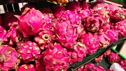 Pile of Dragon fruits on display at a Supermarket