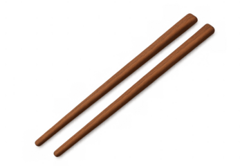 Wooden chopsticks offering a pair of utensils for enjoying asian cuisine and a variety of dishes with a clear background