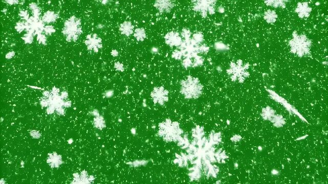Snowflakes Falling on Green Background - This video shows white snowflakes falling against a vibrant green background.