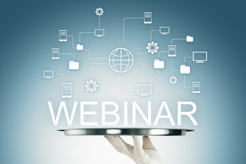 Webinar concept with digital network icons, globe symbol, and hand holding tray on gradient background representing online learning and education.