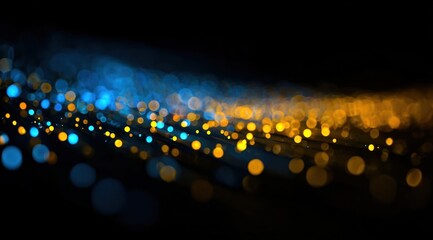 Abstract background of flowing blue and orange light bokeh circles.