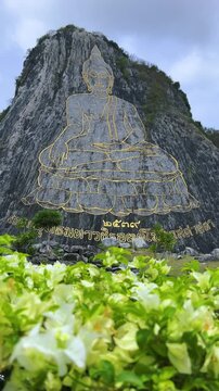 CHONBURI, Thailand - June 9, 2025: The Golden Buddha Mountain. The Buddha image carved into the rock of Khao Chi Chan, Khao Chion, Pattaya, engraved in gold,on a hill dedicated to His Majesty the King