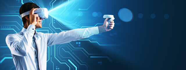 Man using virtual reality headset and controller against glowing tech background with futuristic digital interface in vibrant blue tones.