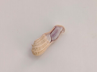 One peanut on a white background.