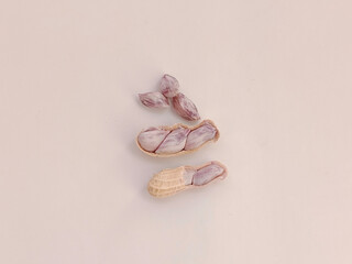 Top view of Boiled peanuts, both shelled and unshelled, on a white background.