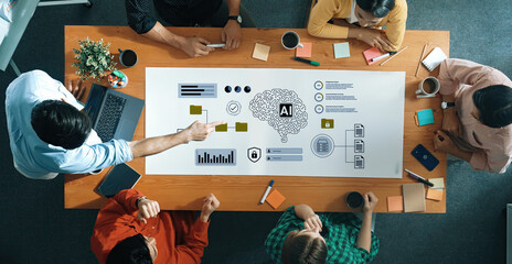 A diverse team collaborates in a modern workspace, sharing insights and strategies about artificial intelligence using charts, digital tools, and data visualizations. Gantry