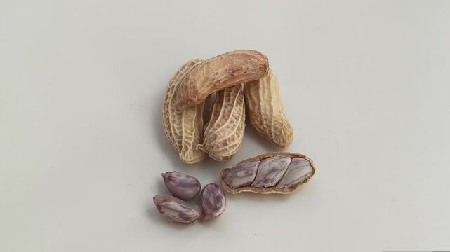 Top view. Boiled peanuts on a white background.
