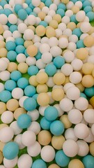 Vibrant and Playful Ball Pit Background with Soft Tones of Blue, Yellow, and White Spheres, Perfect for Children's Fun and Games