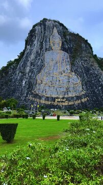 CHONBURI, Thailand - June 9, 2025: The Golden Buddha Mountain. The Buddha image carved into the rock of Khao Chi Chan, Khao Chion, Pattaya, engraved in gold,on a hill dedicated to His Majesty the King