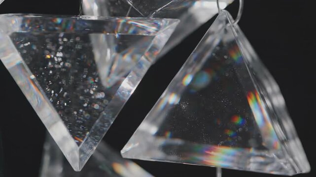 Translucent Triangle: Transparent geometric crystal, refracting light with prismatic effects, suspended, exuding an aura of elegance and modern design.