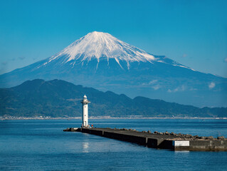 The offshore lighthouse provide a picturesque foreground to the iconic Mount Fuji, Miho no Matsubara beach, Honshu, Japan