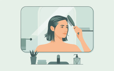 A woman is combing her hair in front of a bathroom mirror with various grooming tools on the counter