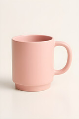 A simple pink ceramic mug with a handle, perfect for your morning coffee